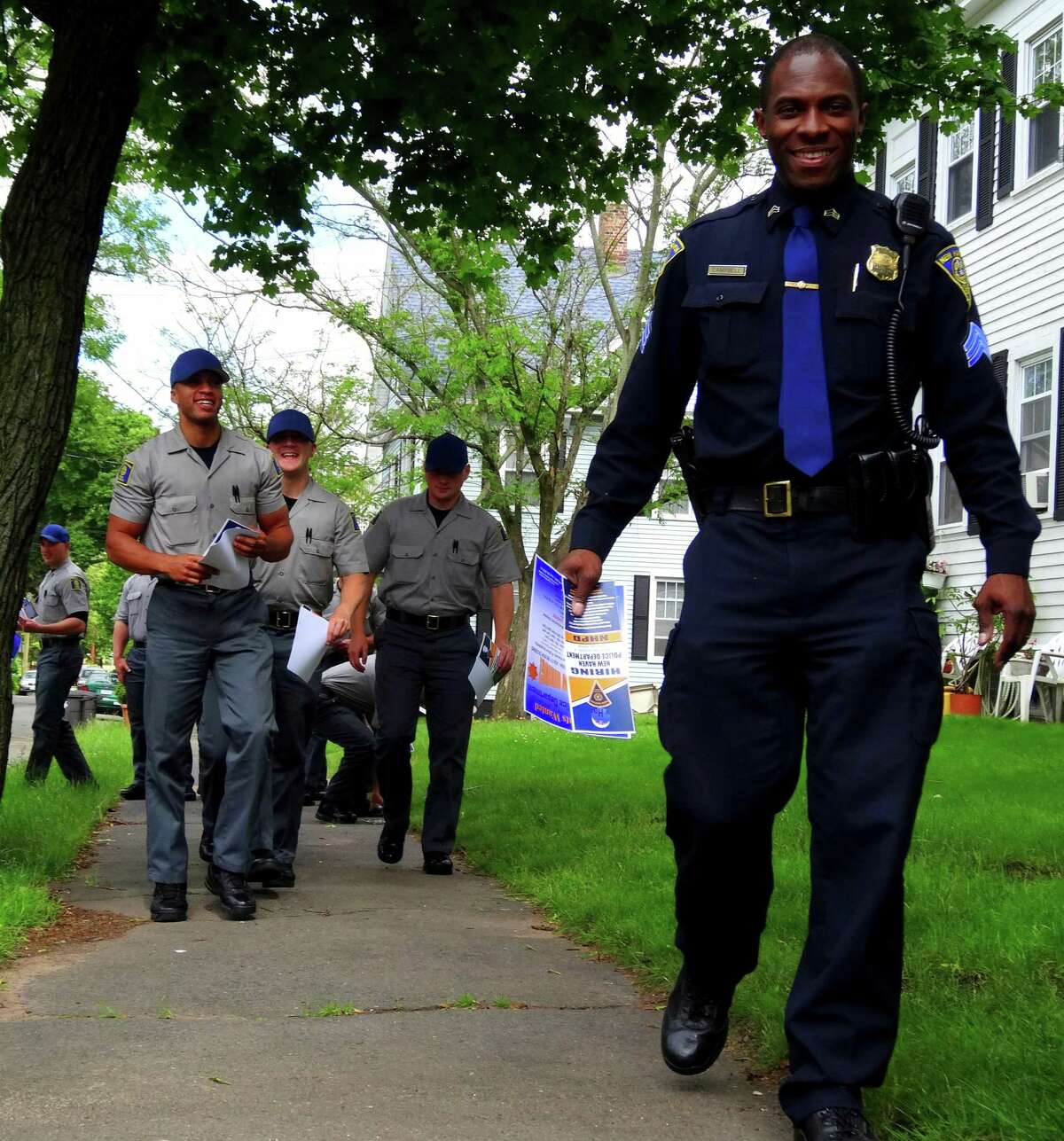 Sgt. Anthony Campbell, director of New Haven Police Academy, with the recruiting recruits. Darren Yip/For the Register