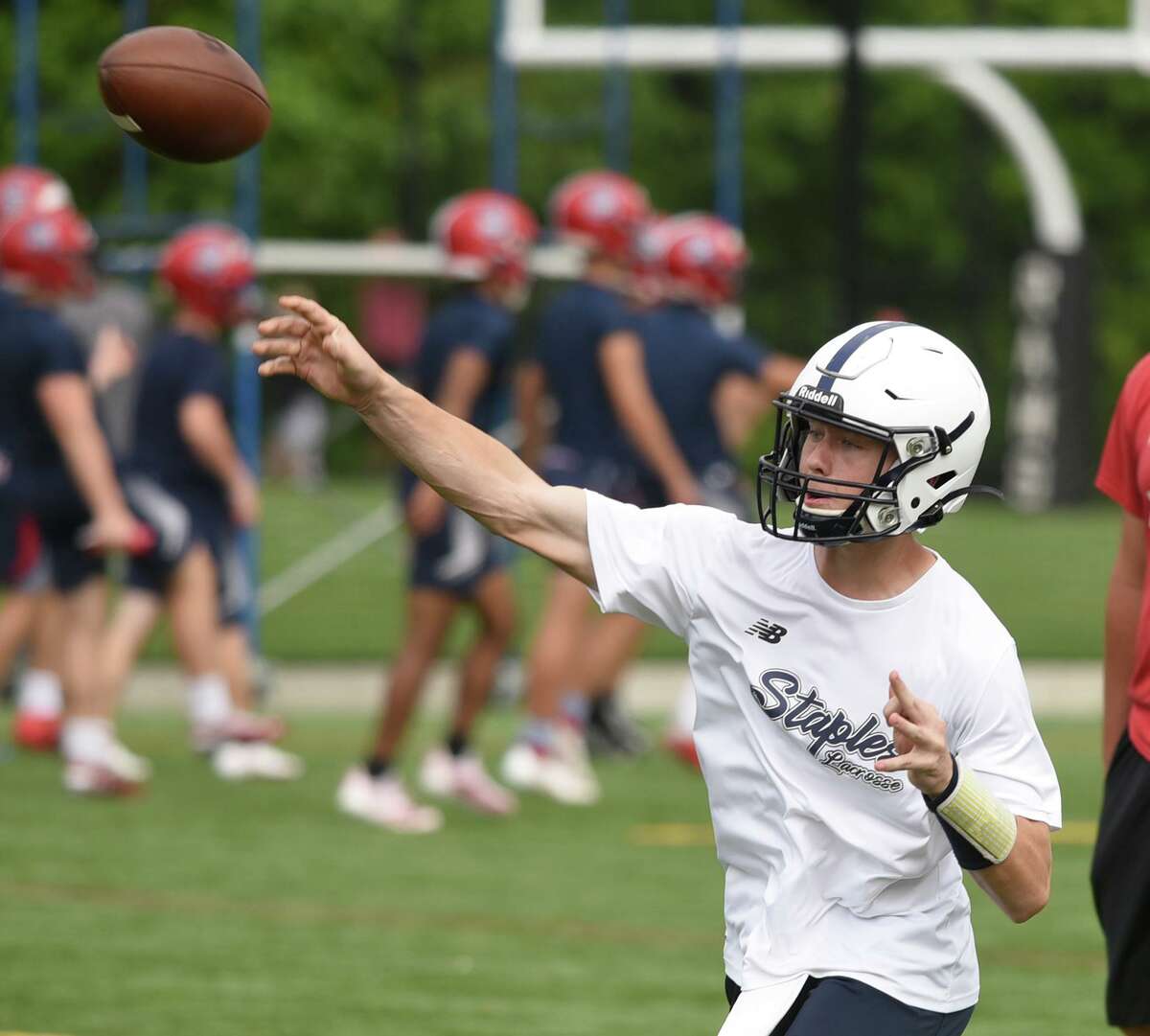 Staples’ quarterback Ryan Thompson throws a pass during Day 2 of the Grip It and Rip It football tournament in New Canaan on Saturday, July 10, 2021.