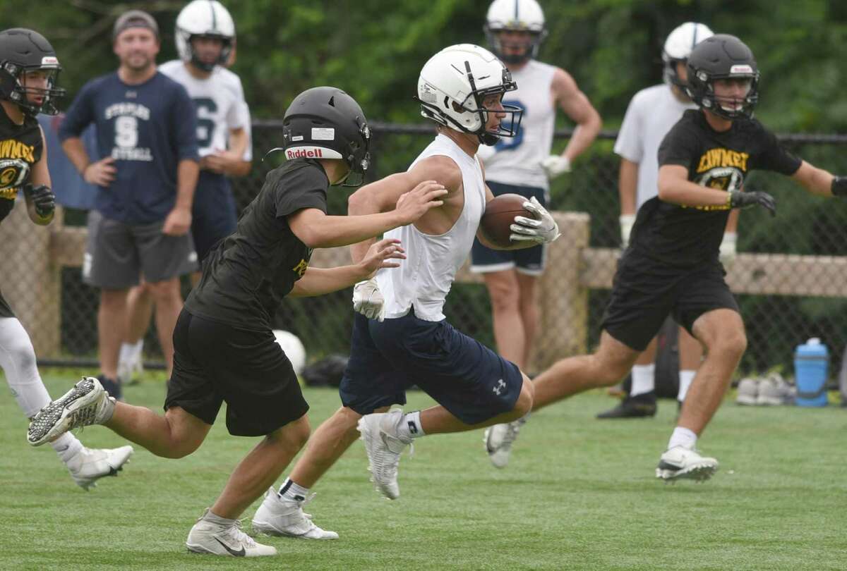 Staples’ Jason Wolgast carries the ball after a reception during the second day of the Grip It and Rip It tournament in New Canaan on Saturday, July 10, 2021.