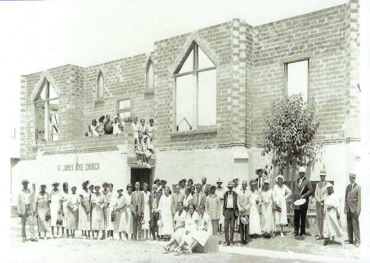 A circa-1930s photo shows the congregation of St. James AME Church at its current location, 402 N. Richter St., while the building was under construction. The area around the church on the near West Side is one of the neighborhood identified as an area of focus for a new city African American heritage initiative. The foundation of one of the church's early locations from the 1870s was recently discovered by San Pedro Creek.