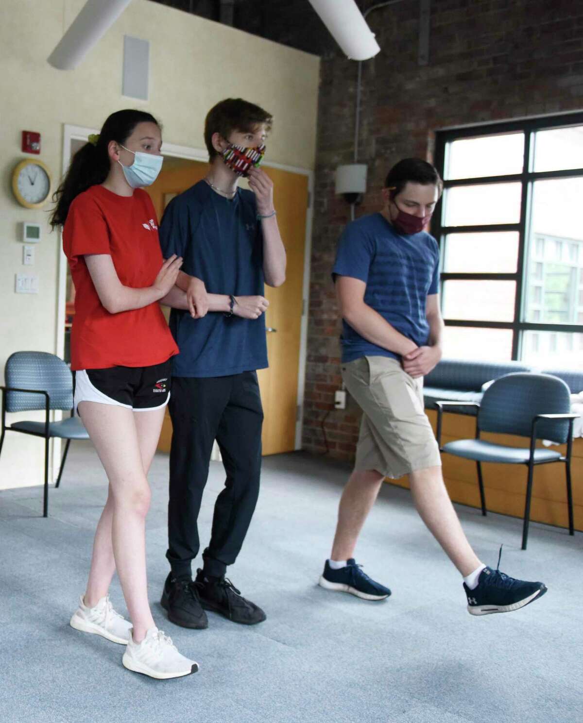 Joelle Singer Jensen and Ben Walker, both 17, rehearse choreography with direction from director Michael Busani, right, at River House in the Cos Cob section of Greenwich, Conn. Sunday, July 11, 2021. Unlike many of the arts organizations in town, Greenwich Arts Alliance never closed during the COVID-19 pandemic. The nonprofit, which uses therapeutic arts programs to educate students and seniors, began rehearsal in person again during the first week in June and plans to host two upcoming shows in mid-and-late July.