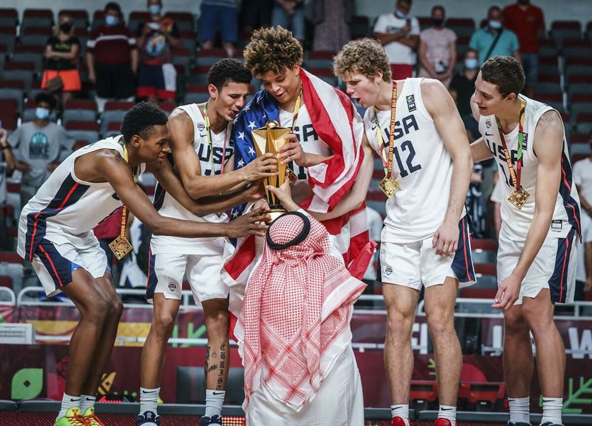 Port Arthur's Kenneth Lofton Jr. celebrates with his USA teammates after winning gold on Sunday at the FIBA World Cup in Riga, Latvia.
