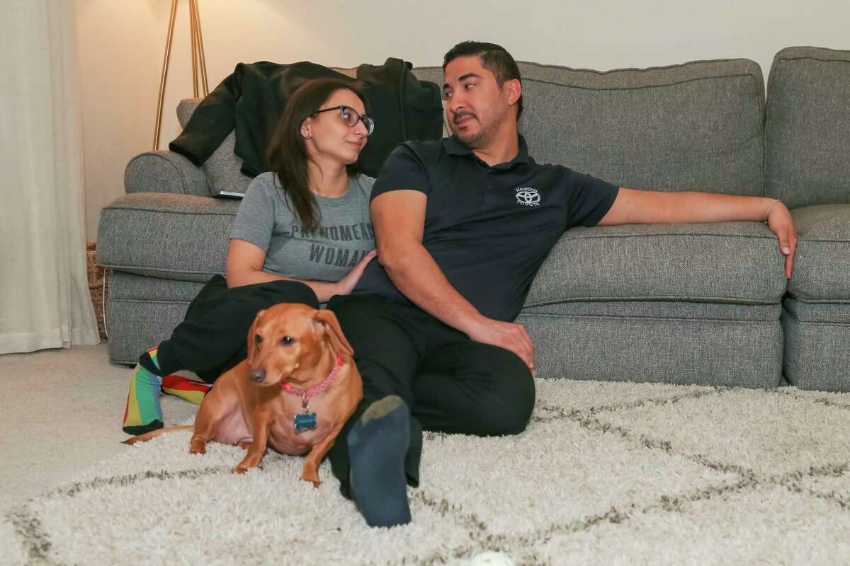 Kelley Perkins and Al Ruiz relax at their home in Clear Lake City, a suburb of Houston. Perkins, an ICU nurse and Ruiz, a finance manger at a car dealership, discuss their thoughts on wearing masks and vaccinations on July 8, 2021 in Houston, TX.