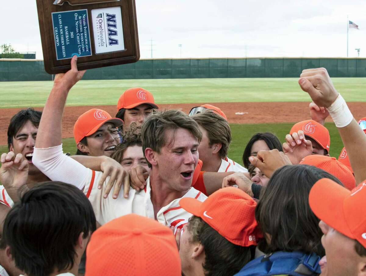 Bishop Gorman High School's right fielder Tyler Whitaker joins his teammates as they celebrate their victory against Palo Verde in the Class 5A regional baseball championship game at Bishop Gorman on Saturday, May 22, 2021, in Las Vegas.