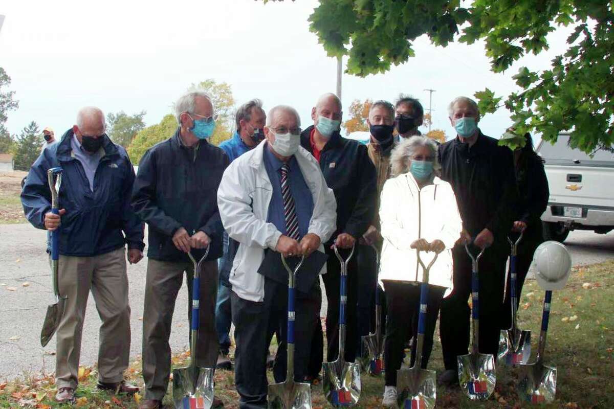 (Front left) Manistee Mayor Roger Zielinski is shown with Manistee City Council members and others for the Hollander Development Corporation and Little River Holdings' groundbreaking ceremony for Hillcrest Apartments in October. (File photo)