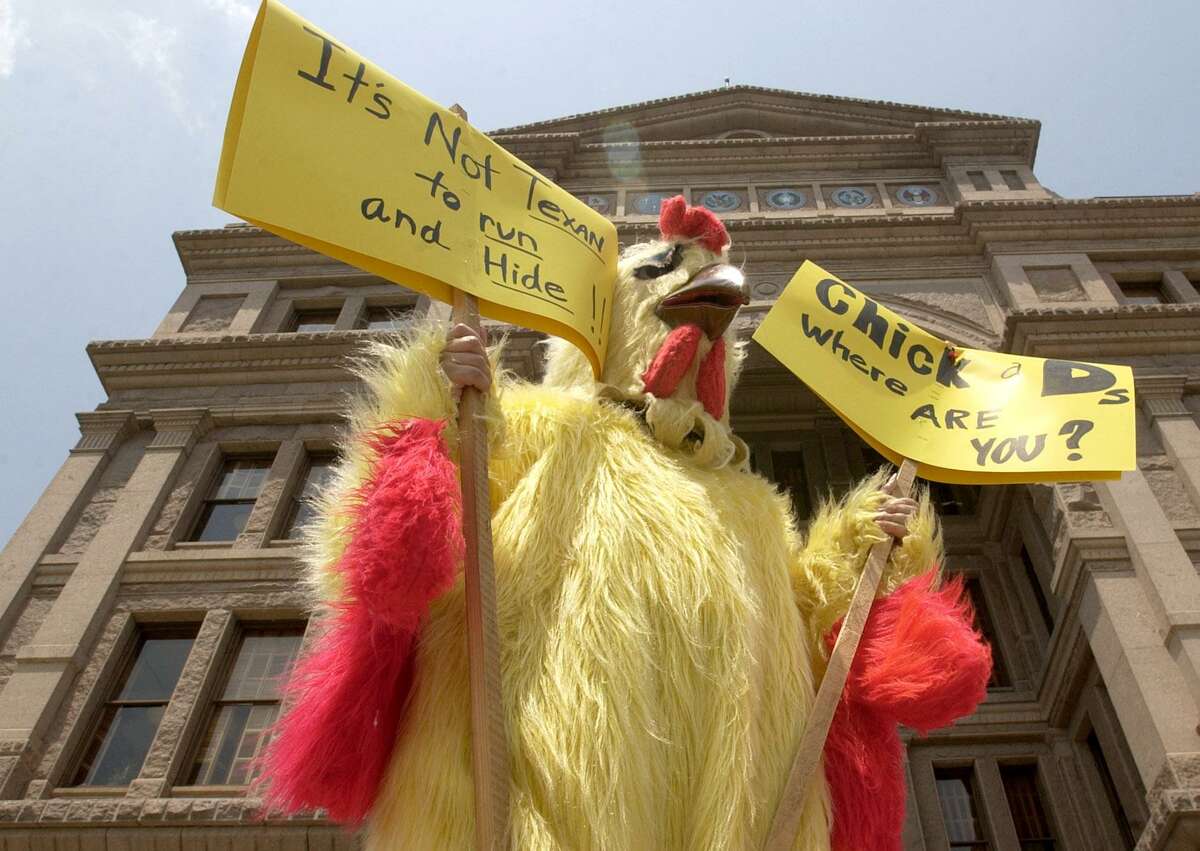 While outside the State Capitol, "The Texas Chicken," expresses his opinion on the missing Deomocrat representatives, Tuesday May 13, 2003 in Austin.