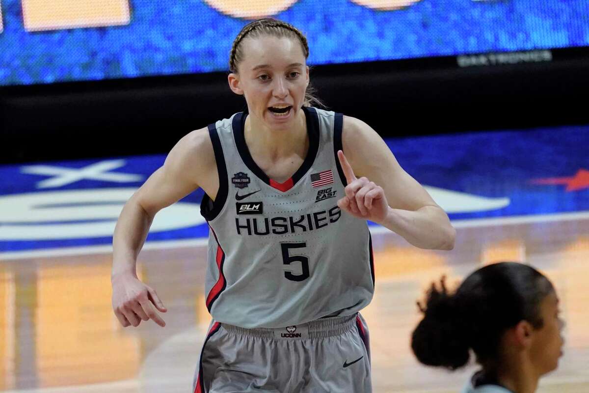Connecticut guard Paige Bueckers (5) reacts after making a basket during the first half of a women's Final Four NCAA college basketball tournament semifinal game against Arizona Friday, April 2, 2021, at the Alamodome in San Antonio. (AP Photo/Eric Gay)