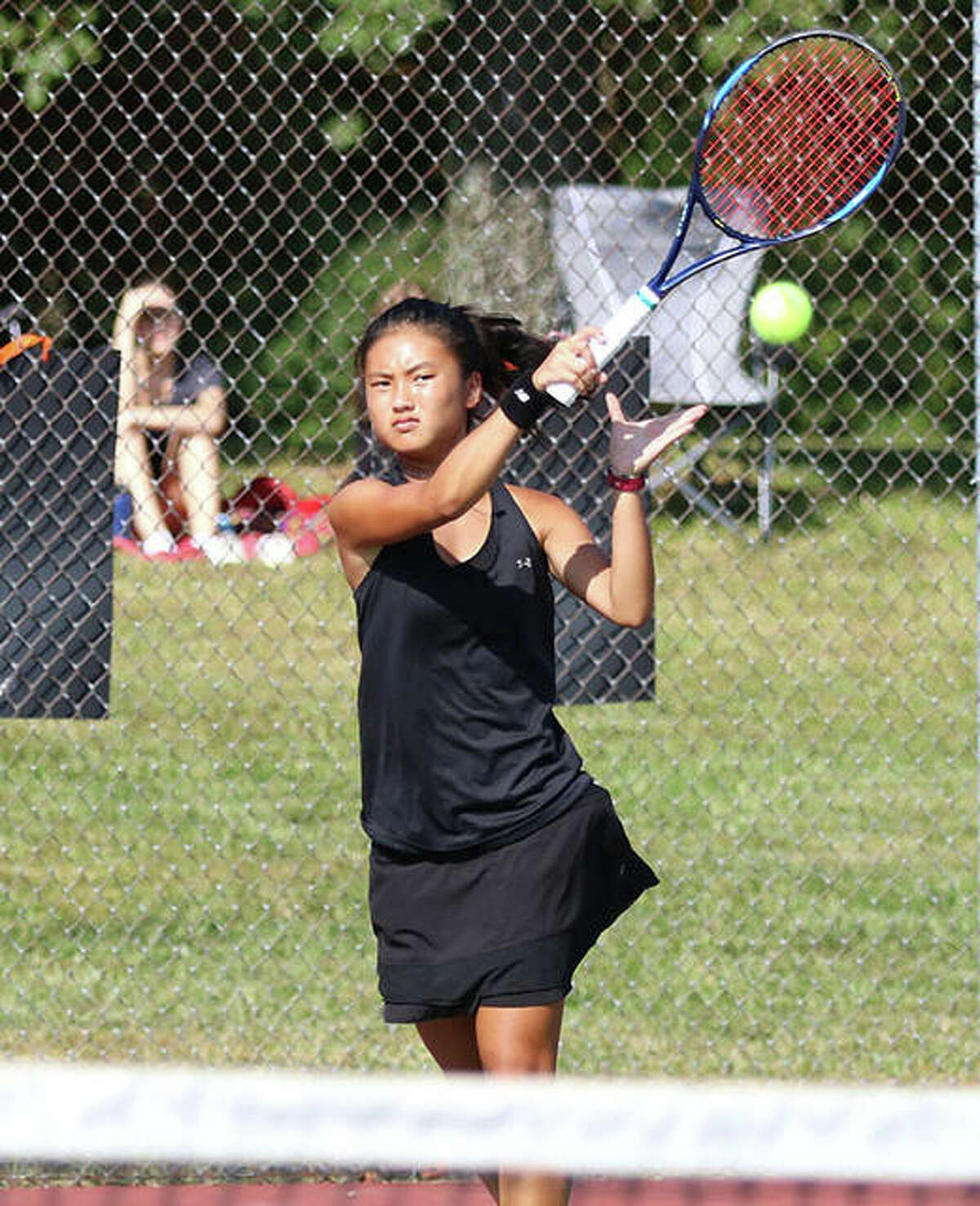 Edwardsville’s Chloe Koons hits a shot a match last season at Edwardsville. Koons finished the season as a SWC and Class 2A sectional singles champion with a 34-0 record.