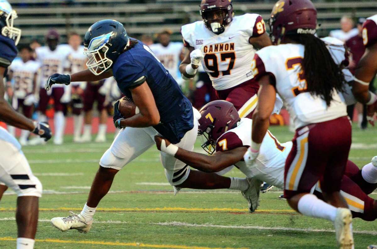 Southern Conn.’s Izaiah Sanders tries to shake Gannon’s Keith Thompson as he carries the ball during action in New Haven in 2019.