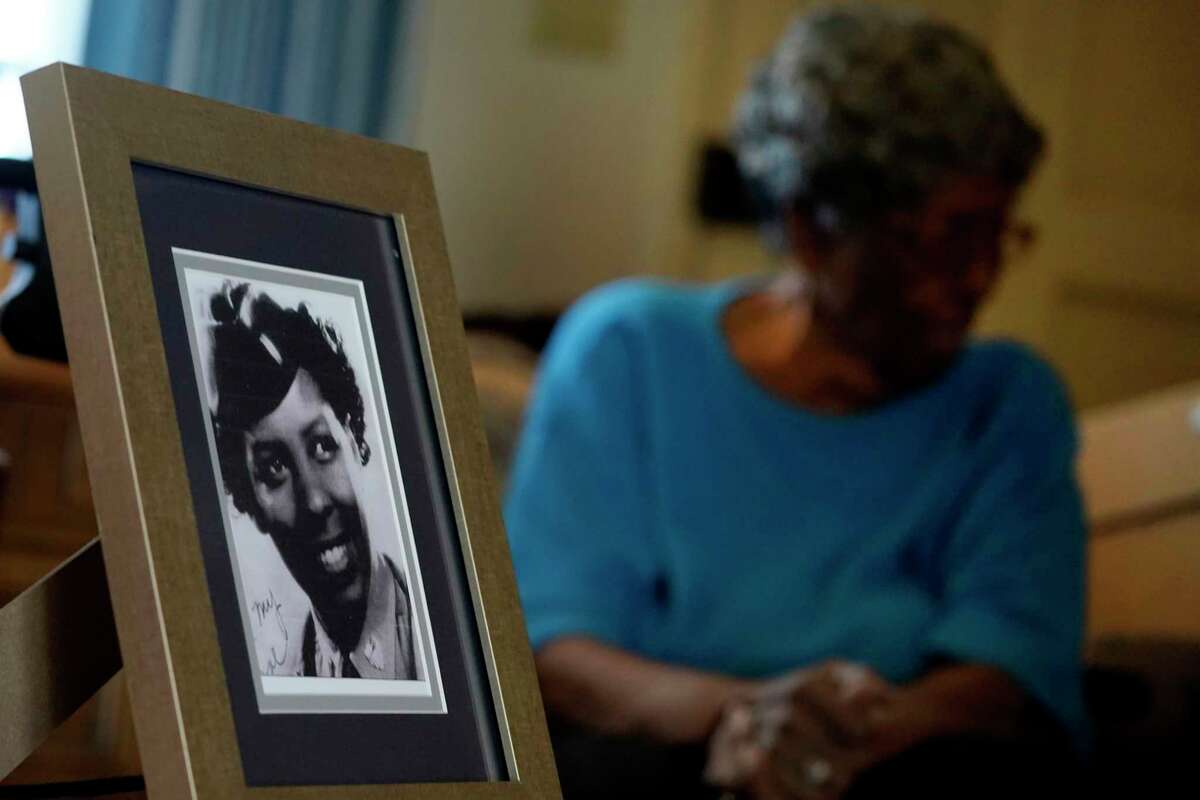 World War II veteran Maj. Fannie Griffin McClendon at her home shows an image of herself in during her time in the military, Thursday, June 10, 2021, in Tempe, Ariz. McClendon had a storied history as a member of the 6888th Central Directory Postal Battalion battalion that made history as being the only all-female, black unit to serve in Europe during World War II.