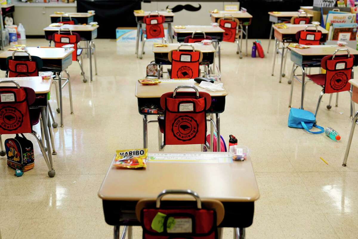 FILE - In this Thursday, March 11, 2021 file photo, desks are arranged in a classroom at an elementary school in Nesquehoning, Pa.