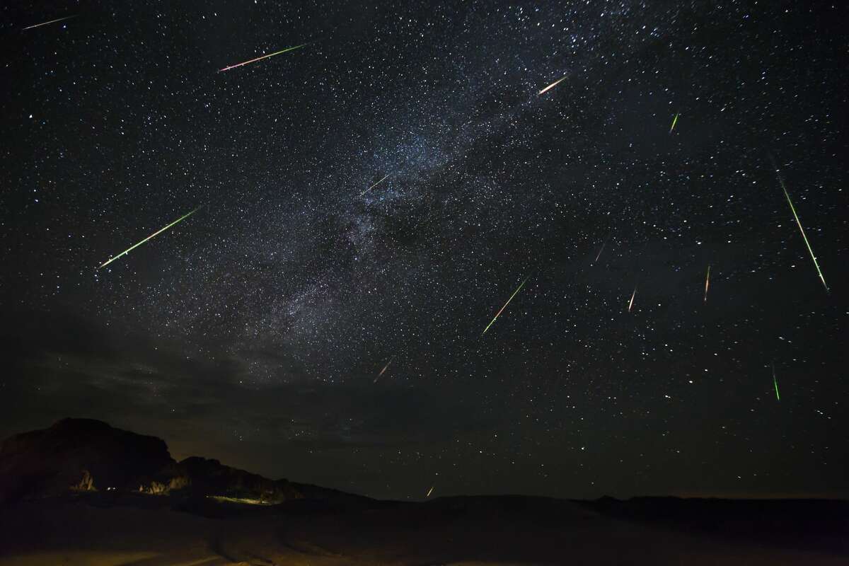 Meteors of the Perseid Meteor Shower are seen as they dart across the night sky on Aug. 14, 2016 in Terlingua, Texas. 