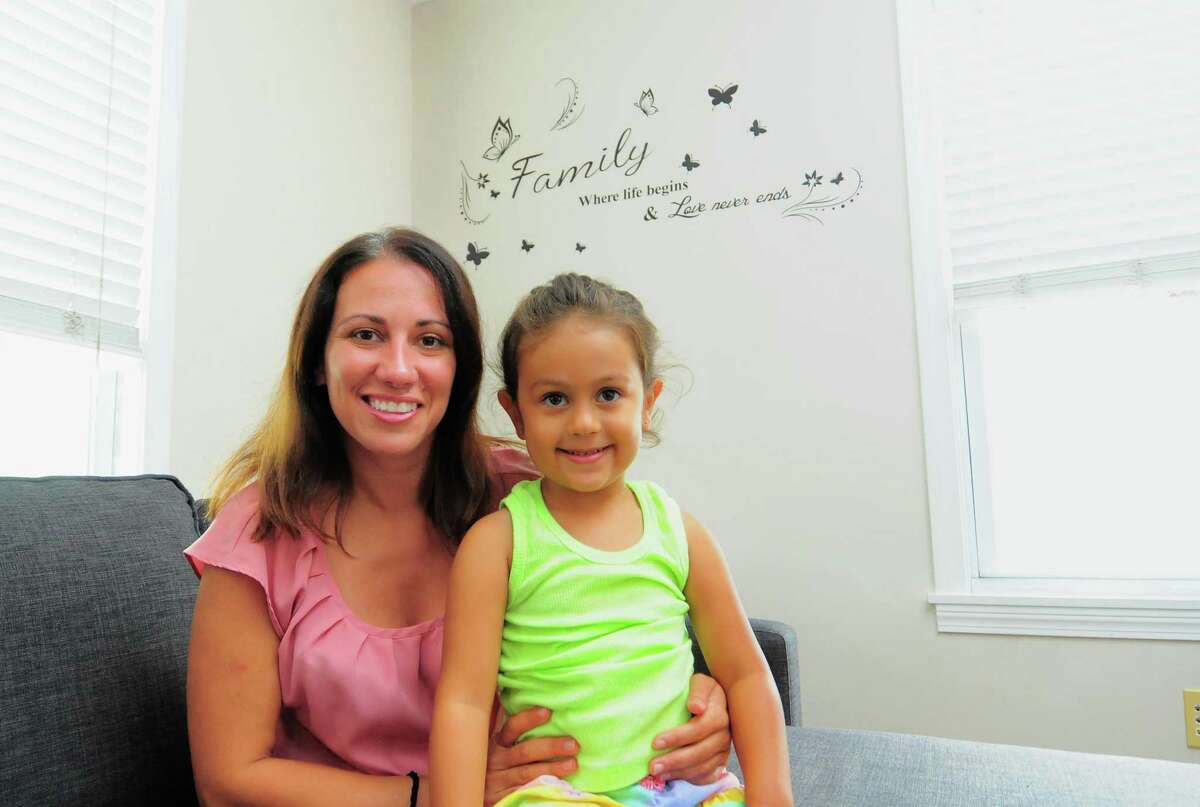 Danielle Cartolano and her daughter Isabella, 4, pose at their home in Greenwich, Conn., on Friday July 9, 2021. Cartolano participated in Family Centers' Parents as Teachers program.