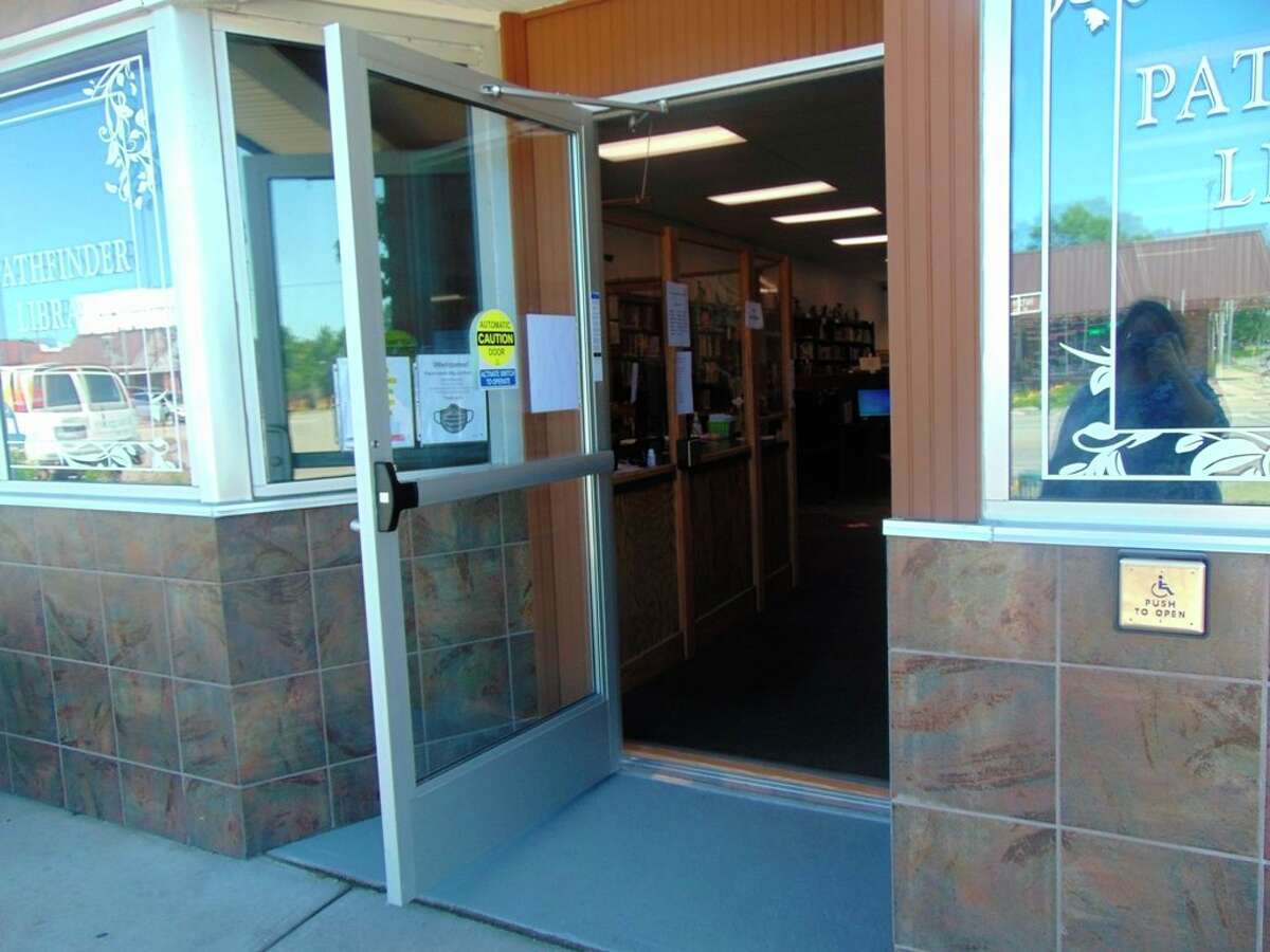 Patrons at the Pathfinder Community Library will have easier access to the library, thanks to the instillation of a new automatic door, made possible by two grants. (Star photo/Shanna Avery)