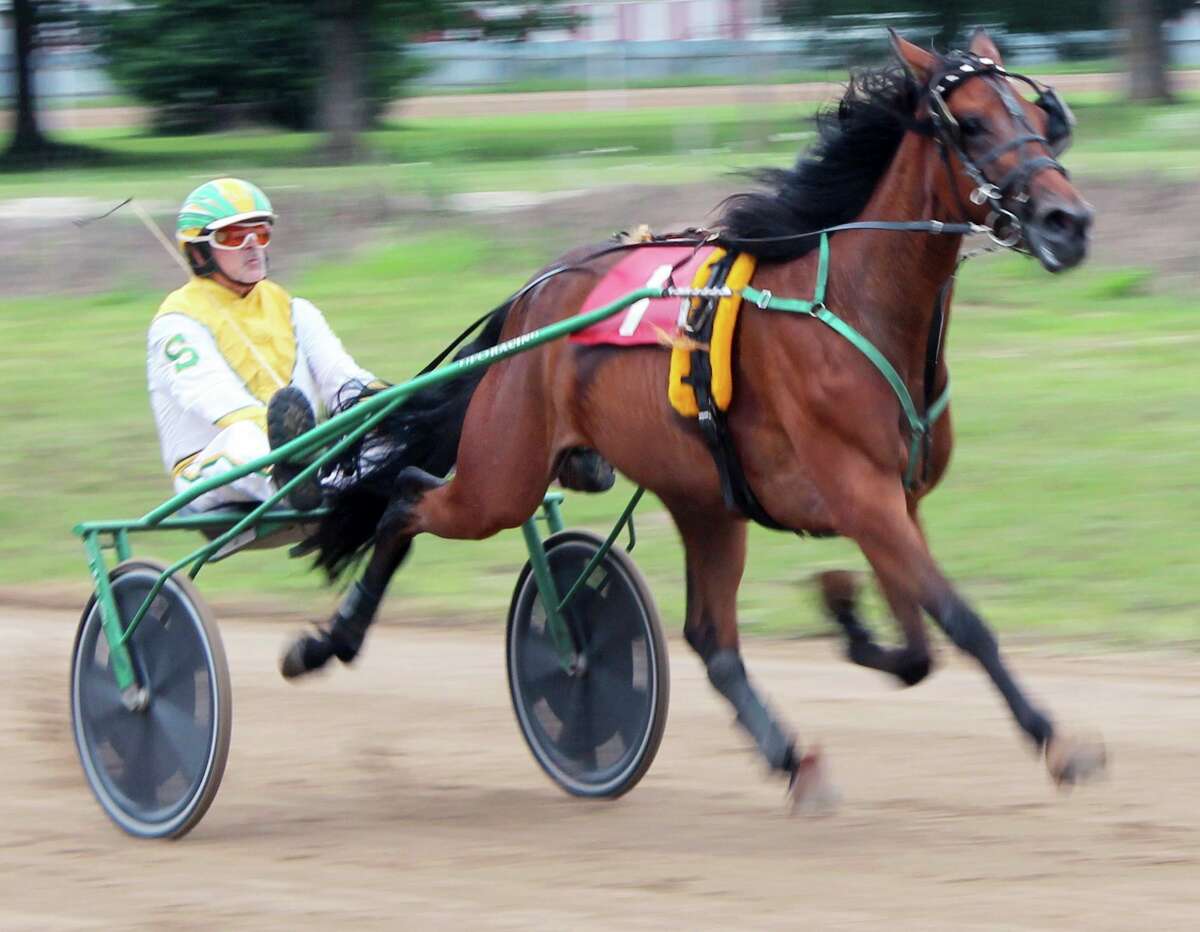 Smith and his colt prepare to hit the home stretch during Monday's harness race at the Mecosta County Fair. (Pioneer photo/Joe Judd)