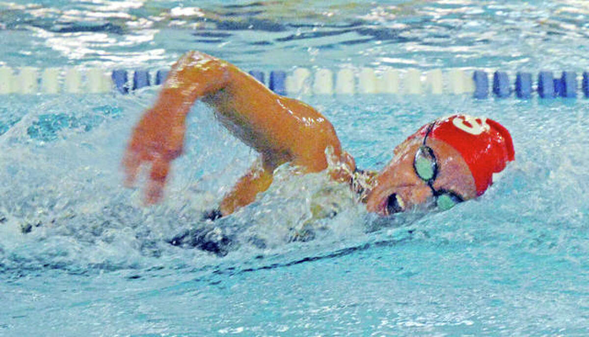 Eleni Kotzamanis of Alton High swim the 200-yard freestyle at last season’s IHSA Girls Sectional meet at the Chuck Fruit Aquatic Center in Edwardsville. Kotzamanis was second in the event and was second in the 500-yard freestyle. She finished first in the 100-yard backstroke.