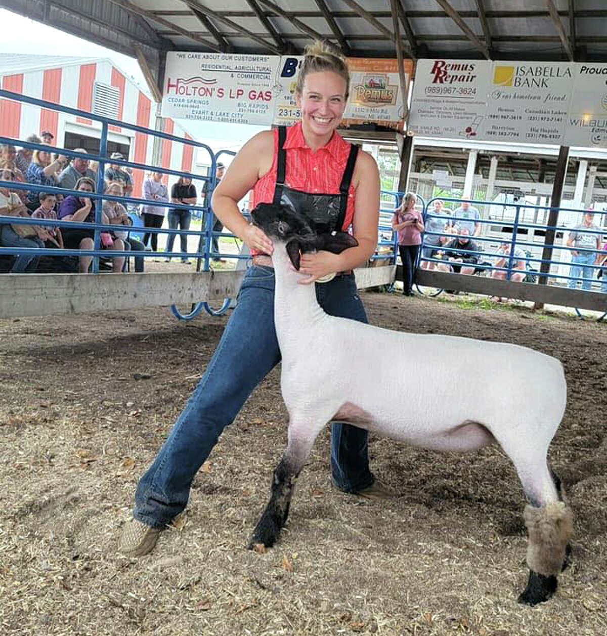 Lauren Marfio plans to sell her Reserve Champion sheep Thursday at Mecosta County's Junior Livestock Auction. She plans to donate her proceeds to the Pritchard family to help them with any medical expenses. Riley Pritchard, 19, was seriously hurt in a car crash in late June. 