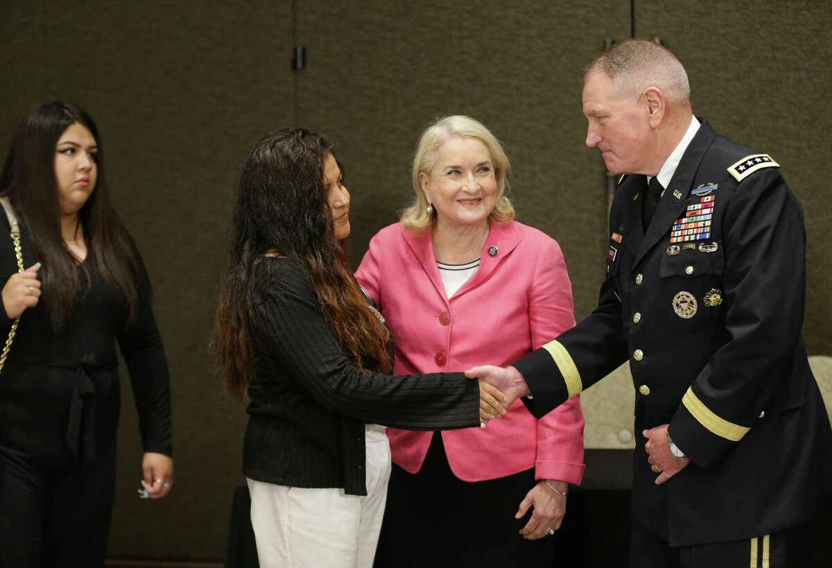 Gloria Guillén shakes hands with U.S. Army General John M. Murray before discussing the latest report on the death investigation of her daughter, Houston soldier Vanessa Guillén, on Tuesday, July 13, 2021, in Houston. Guillén was an Army specialist who was slain while on active duty at Fort Hood in April 2020. Democratic Congresswoman Sylvia Garcia, between them, represents the Guillén’s district in Congress and attended the meeting.
