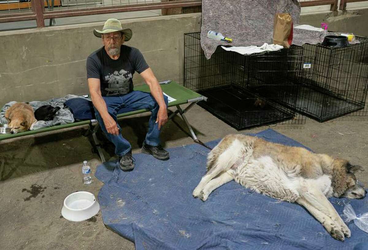 Art Garcia rests after evacuating to a Red Cross shelter near the Bootleg Fire in Klamath Falls, Ore.