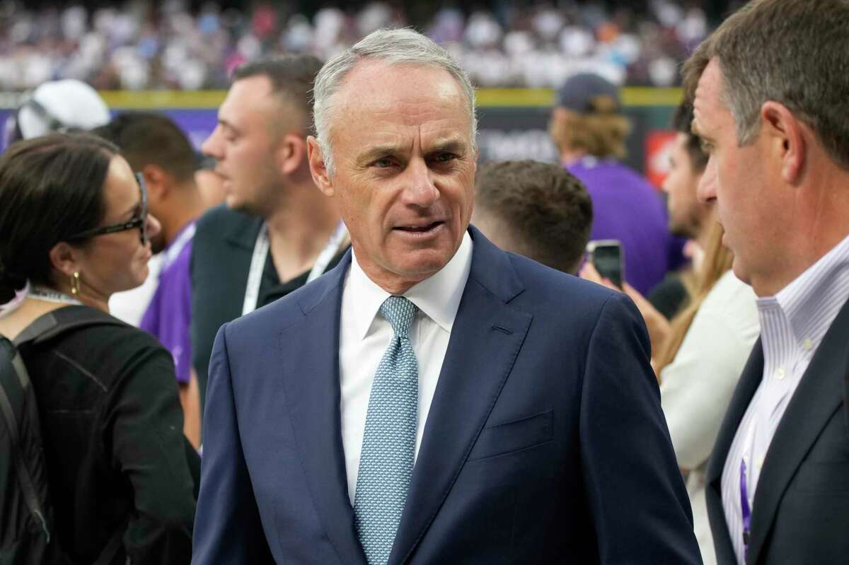 MLB Commisioner Rob Manfred watches batting practice prior to the MLB All-Star baseball game, Tuesday, July 13, 2021, in Denver. (AP Photo/David Zalubowski)