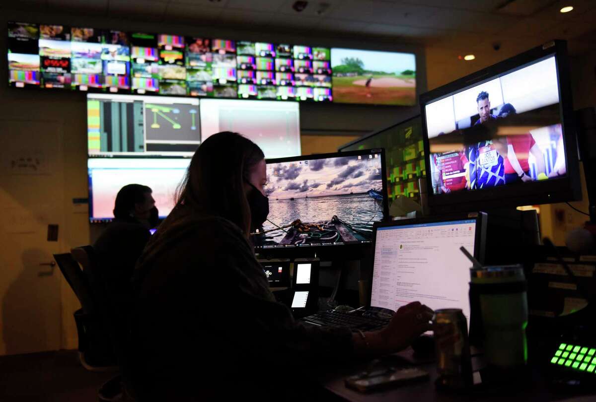 BOC manager Jessica Berkuta works in the broadcast operations center at NBC Sports headquarters in Stamford, Conn. Tuesday, July 13, 2021. NBC Sports is preparing to cover the Tokyo 2020 Olympic Games, which were postponed a year, in a different way than usual due to the lingering pandemic.