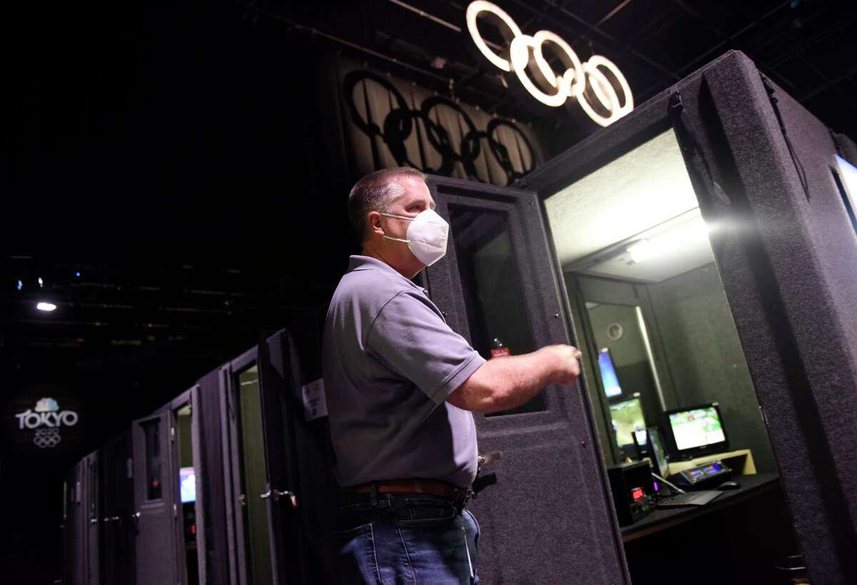 NBC Sports Vice President of Engineering Tim Canary shows the soundproof announcer booths at the NBC Sports headquarters in Stamford, Conn. Tuesday, July 13, 2021. NBC Sports is preparing to cover the Tokyo 2020 Olympic Games, which were postponed a year, in a different way than usual due to the lingering pandemic.