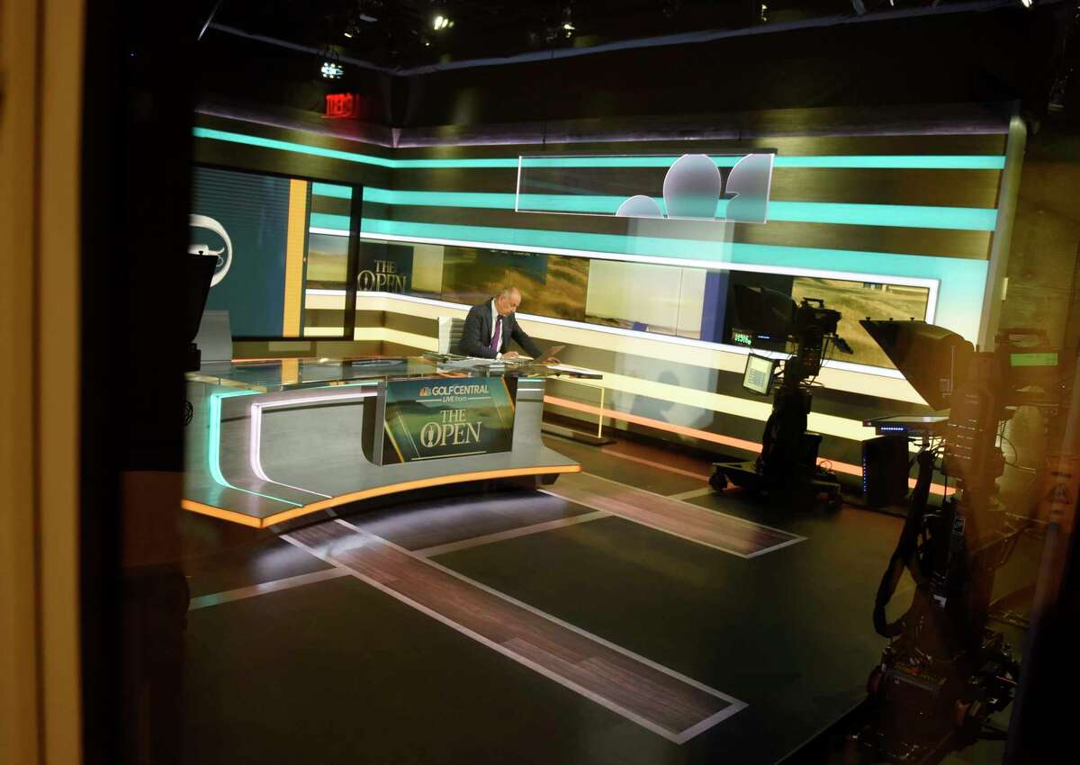 Golf analyst works in the broadcast studio at NBC Sports headquarters in Stamford, Conn. Tuesday, July 13, 2021. NBC Sports is preparing to cover the Tokyo 2020 Olympic Games, which were postponed a year, in a different way than usual due to the lingering pandemic.