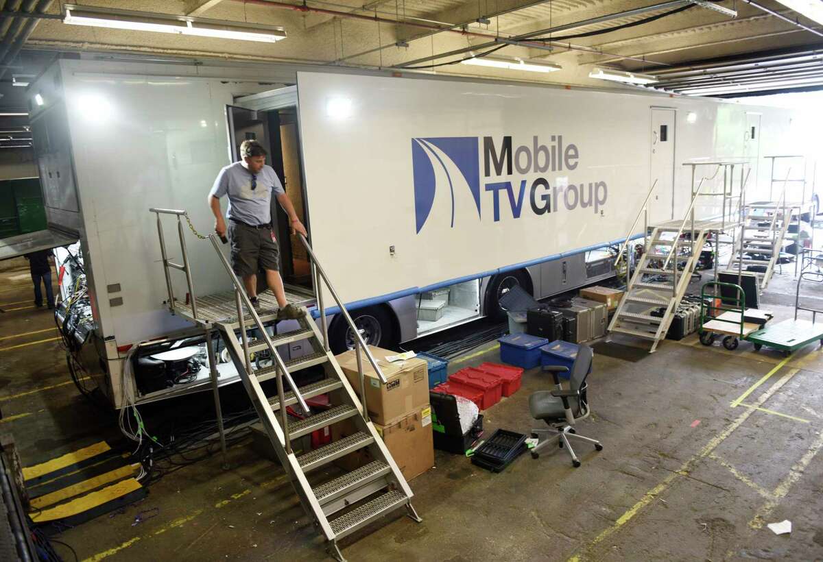 Mobile trailers are brought in to assist with Olympic coverage at NBC Sports headquarters in Stamford, Conn. Tuesday, July 13, 2021. NBC Sports is preparing to cover the Tokyo 2020 Olympic Games, which were postponed a year, in a different way than usual due to the lingering pandemic.