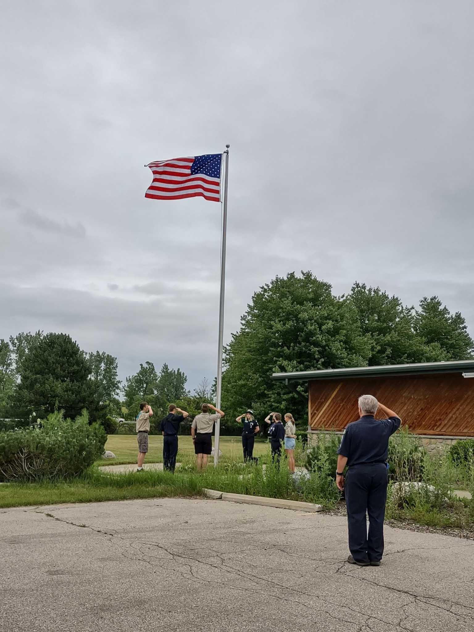 Gleaner Life Insurance presents flag to Boy Scouts