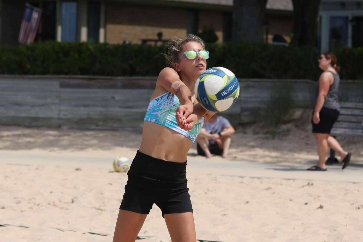 Nearly three dozen teams compete in a youth volleyball tournament at Frankfort Beach on July 11. 