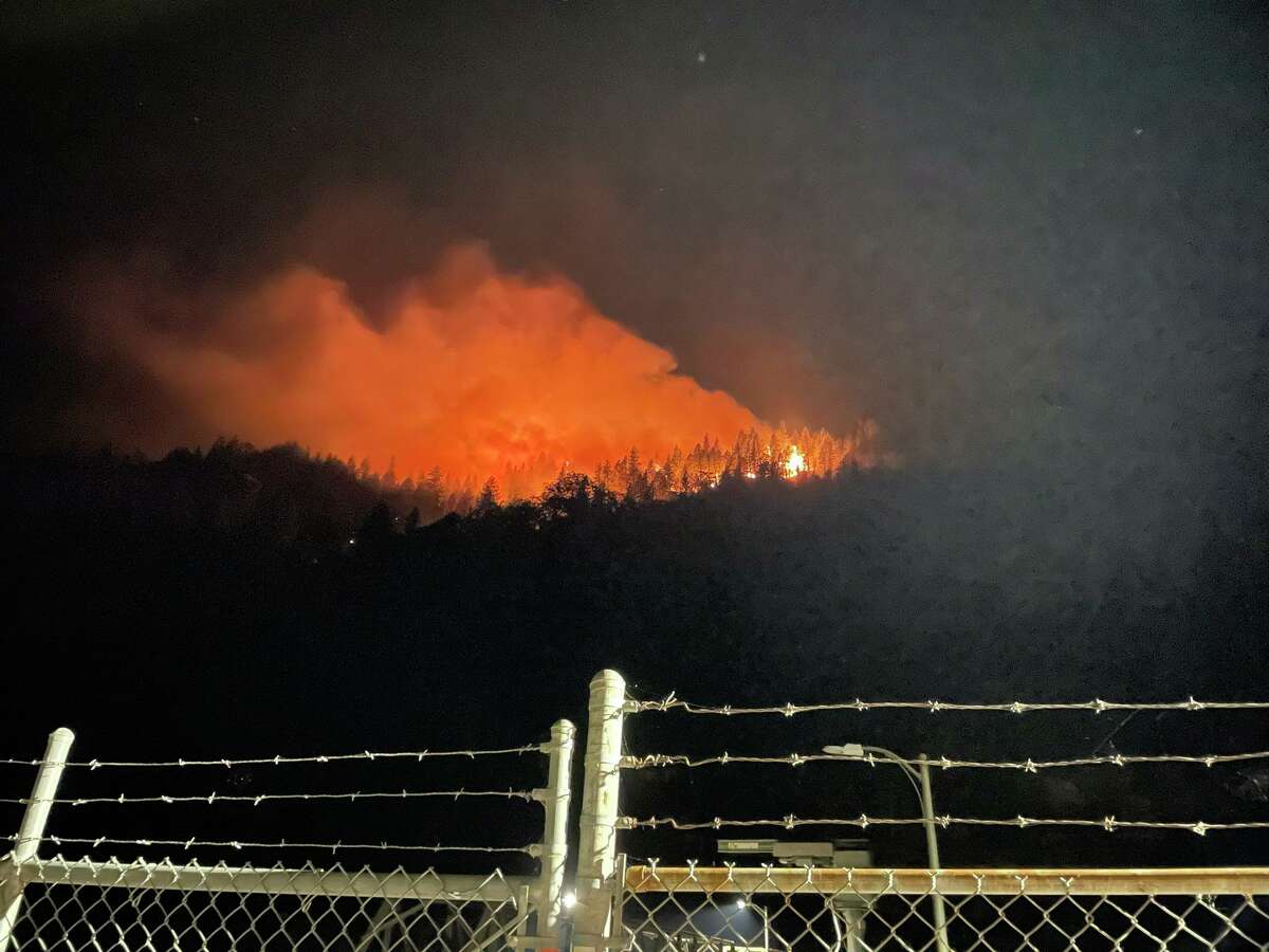 A photo of the Dixie Fire burning across 1,200 acres in the Feather River Canyon near Highway 70 in Butte County Wednesday morning.