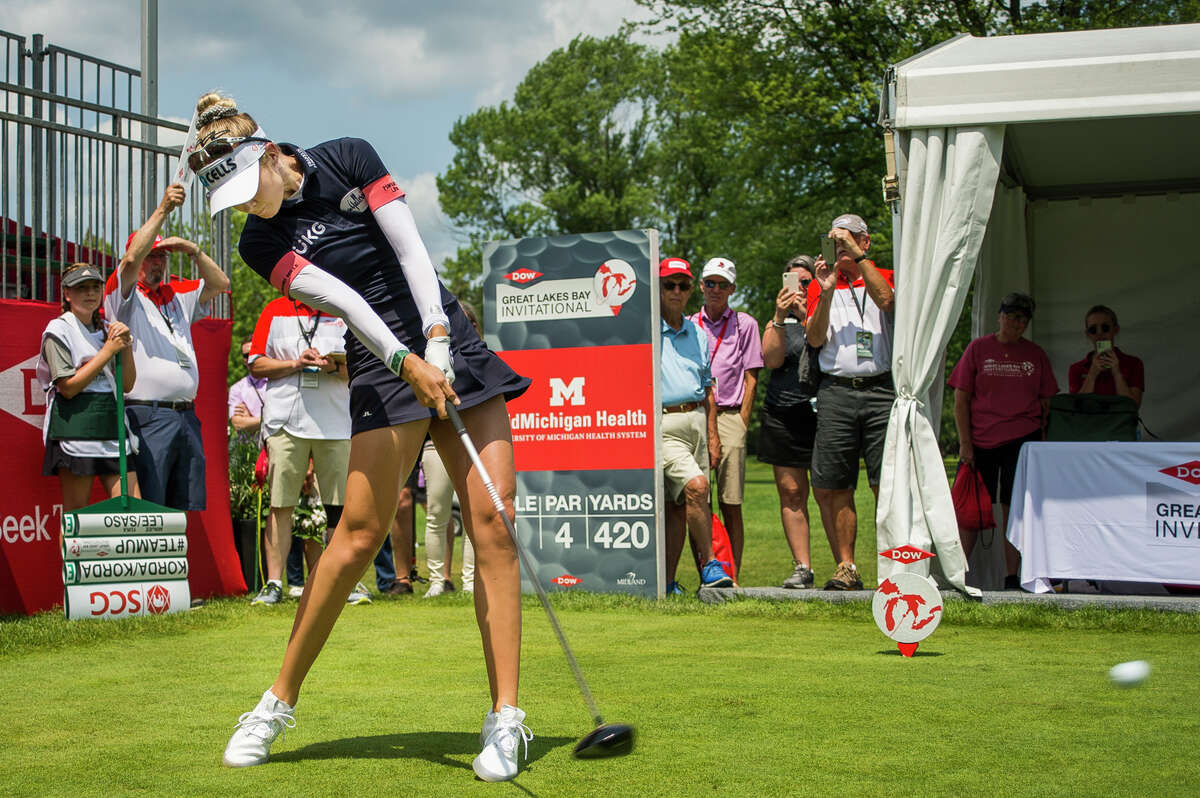 LPGA player Nelly Korda tees off during the first round of the Dow Great Lakes Bay Invitational, after her caddie was given a green bib indicating her status as the No. 1 player in the Rolex Women's World Golf Rankings, Wednesday, July 14, 2021 at the Midland Country Club. (Katy Kildee/kkildee@mdn.net)
