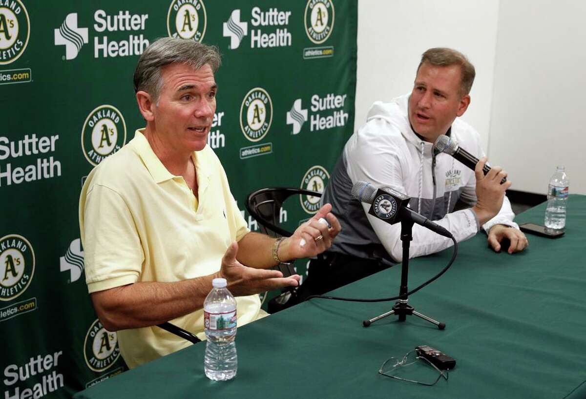 Oakland Athletics VP of baseball operations Billy Beane, (left) and general manager David Forst talk about the end of the season during a press conference at the Oakland Coliseum on Mon. Oct. 2, 2017, in Oakland, Ca.