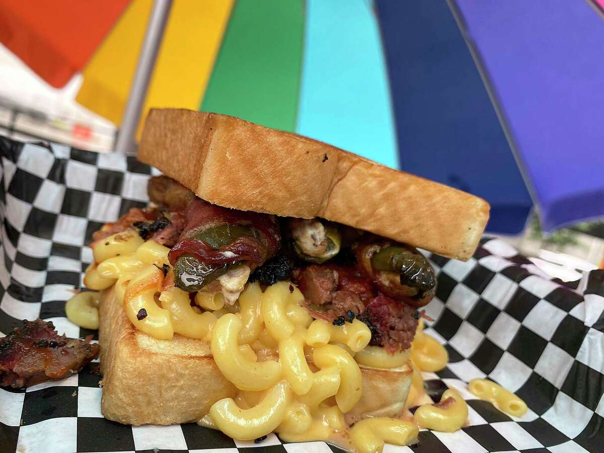 The Holy Grailed Cheese sandwich at Holy Smoke Barbecue + Taquitos includes brisket and macaroni and cheese on Texas toast with optional Texas Twinkies, smoked jalapeños wrapped with bacon and stuffed with brisket and cheese.