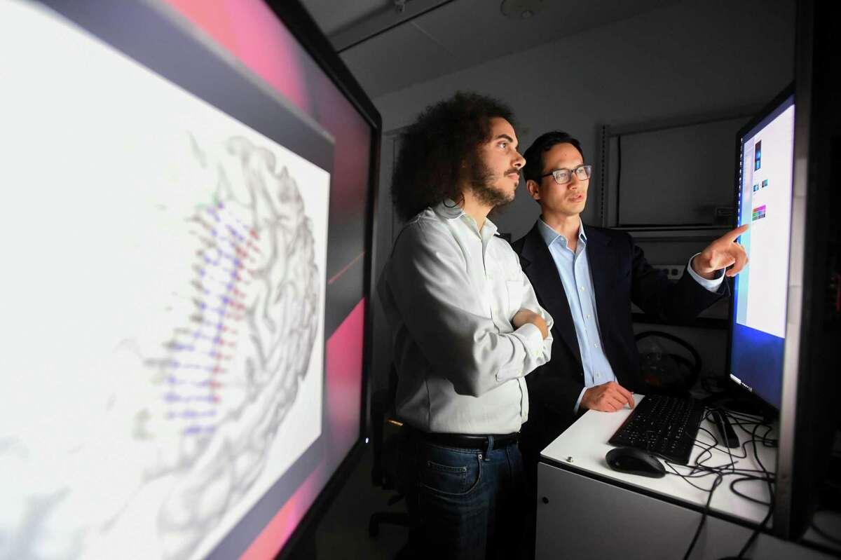 David Moses and Dr. Edward Chang collaborate in Chang’s lab at UCSF. .