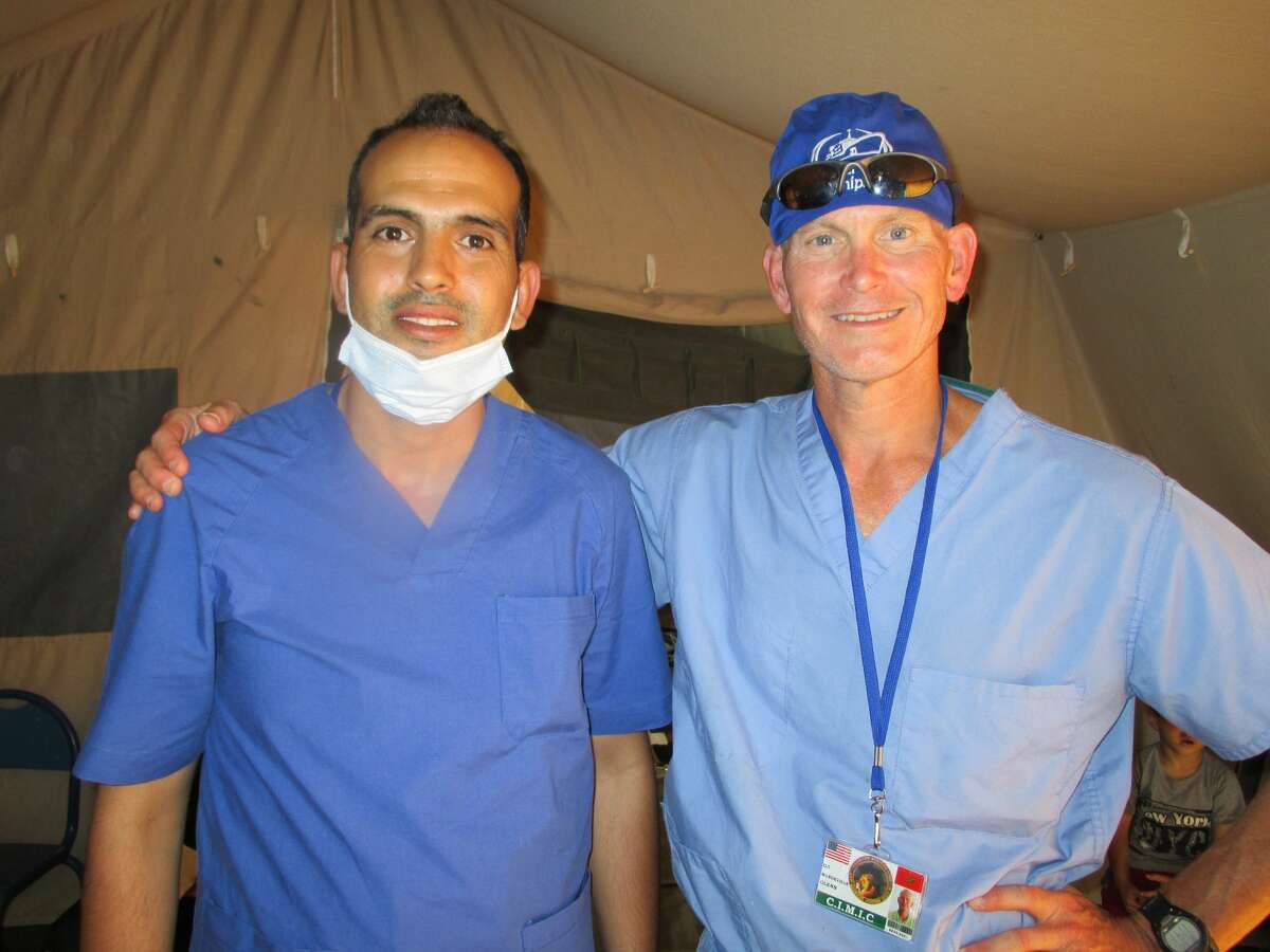 Dr. Glenn Mandeville (right) poses for a photo with a Moroccan surgical resident in Morocco while on the Africa Lion 2021 exercise. 