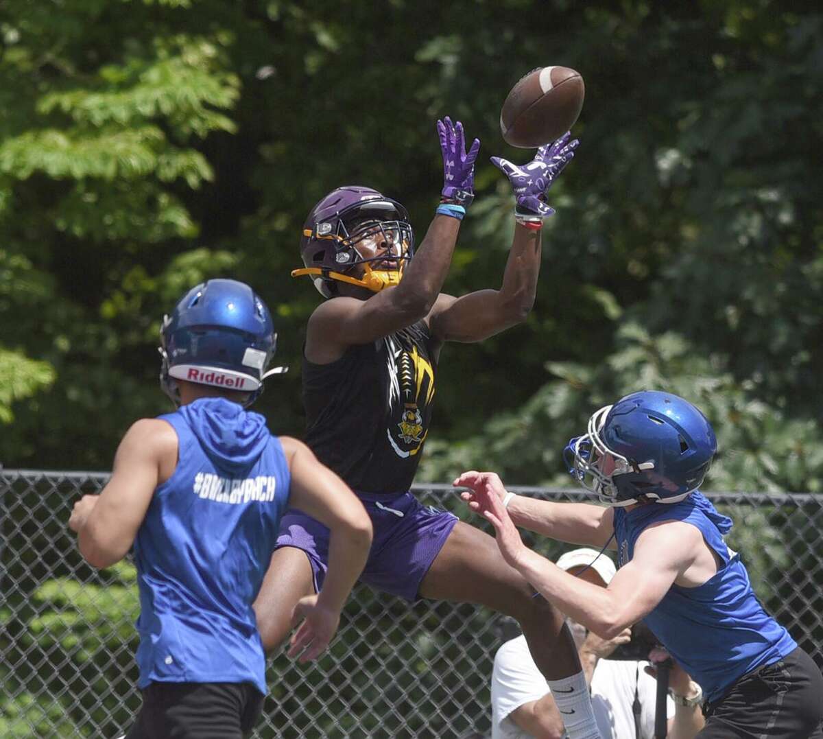 Westhill's David Moody goes up to catch a pass during day one of the Grip It and Rip It football tournament in New Canaan on Friday, July 9, 2021.