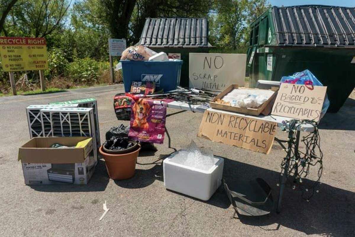 Manistee County's recycling program recently took items from recycling drop off bins that did not belong and shared them on display tables in an effort to educate anyone planning to recycle at the eight townships involved in the program. (Courtesy photos)