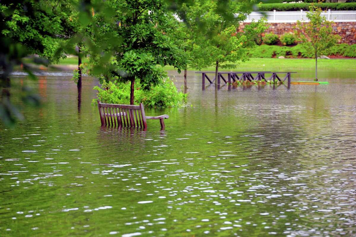 Binney Park in Greenwich is submerged after a tropical storm pounded the region in July 2021. Storms are expected to become more severe as global warming worsens in years to come.