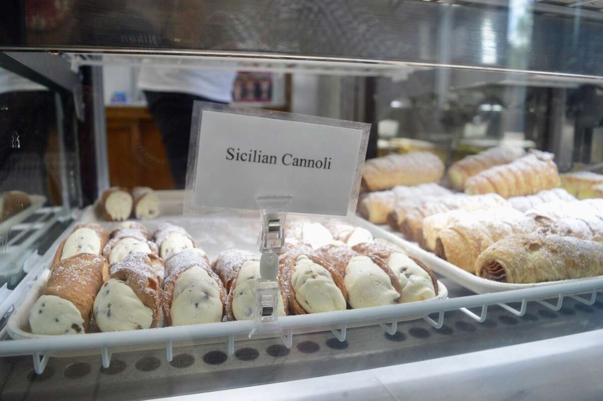 Sicilian cannoli are among the traditional Italian pastries available at Lucibello's Italian Pastry Shop on Grand Avenue in New Haven, Conn. on Wednesday, July 14, 2021. 