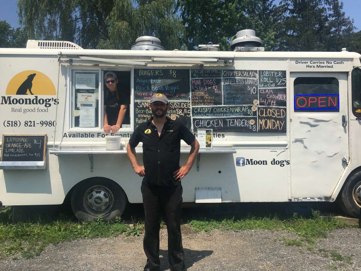Adam Moon (center) began a “pay what you can” program at his Chatham food truck for those in need during the pandemic using a donation from his friend. He thought the money would cover two weeks of free food, but paying customers have been so willing to foot the bill for complimentary meals, the initiative is still going strong.