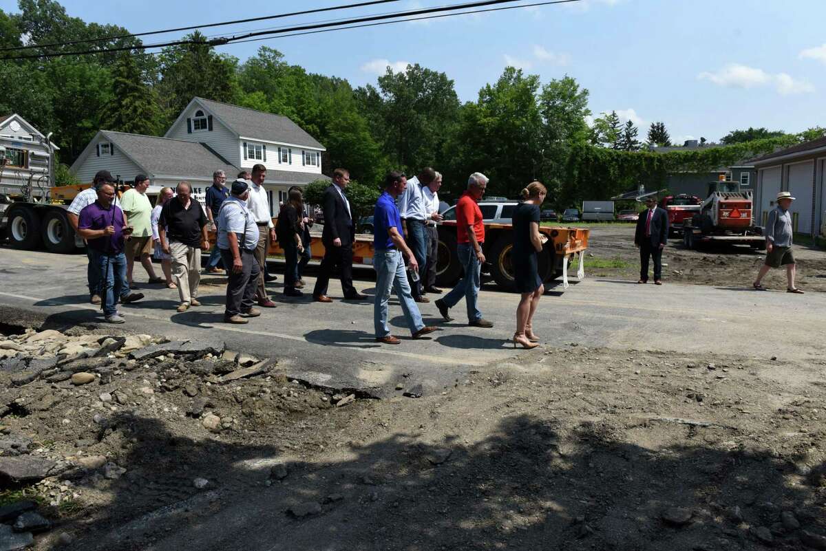 U.S. Agriculture Secretary Thomas Vilsack, U.S. Rep. Antonio Delgado and Rensselaer County Executive Steve McLaughlin examine storm damage at Taborton Road on Thursday, July 15, 2021, in Sand Lake, N.Y. (Will Waldron/Times Union)