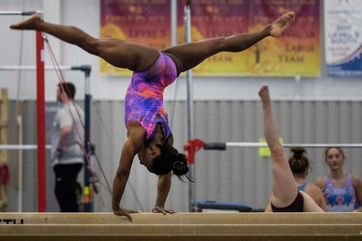 Olympic gymnast Simone Biles works on the balance beam as she prepares for the upcoming Tokyo Olympics at World Champions Centre Tuesday, July 6, 2021 in Spring.