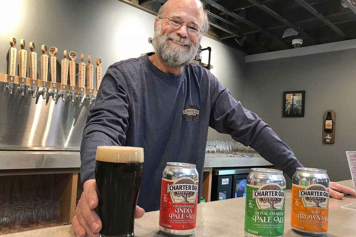 Scott Vallely, owner of Charter Oak Brewing, stands in the brewery's taproom in Danbury in 2018.
