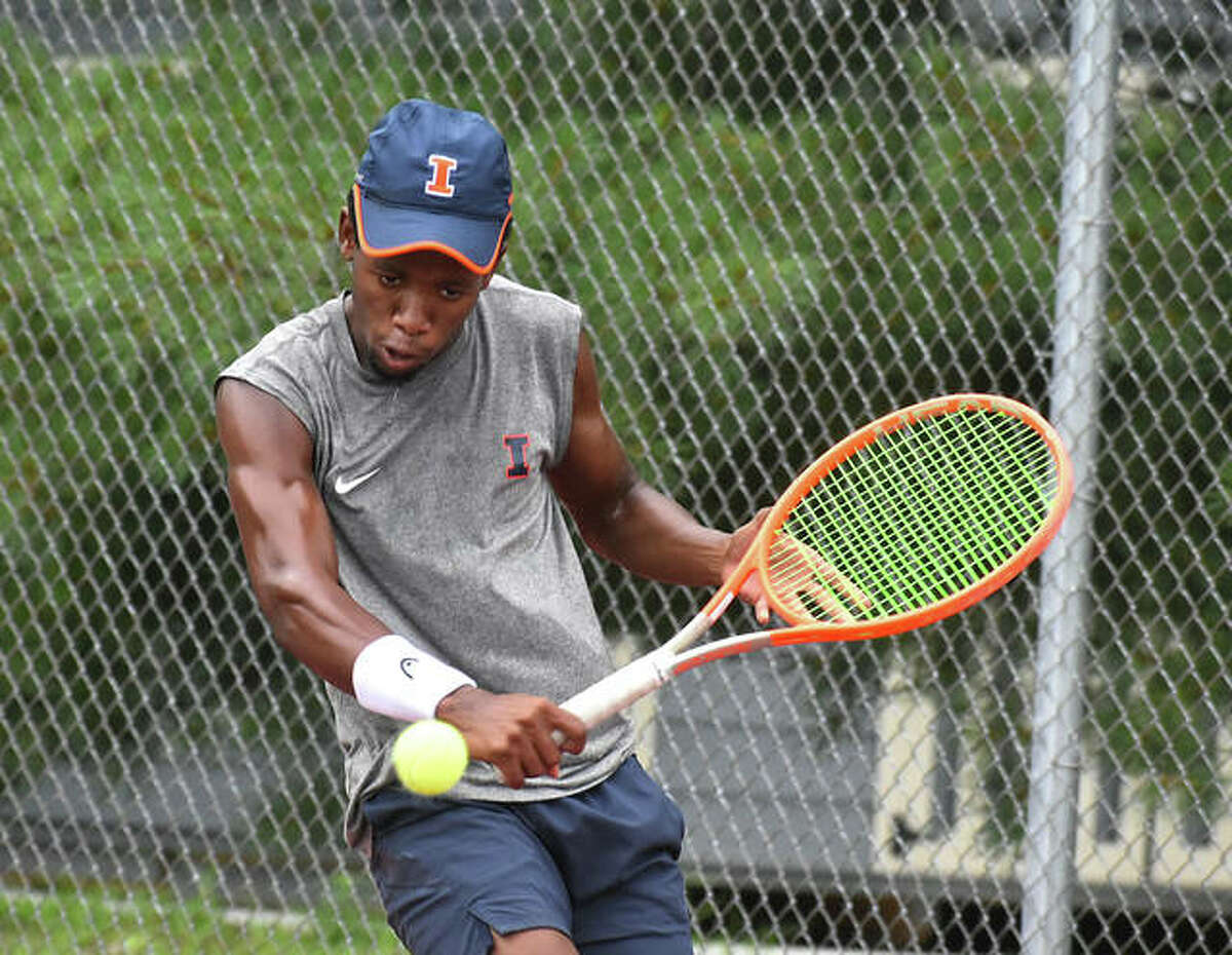 University of Illinois All-American Siphos Montsi hits a backhand shot during his second-round match against Edwardsville’s Colton Hulme at the Edwardsville Wild Card Tournament on Thursday.