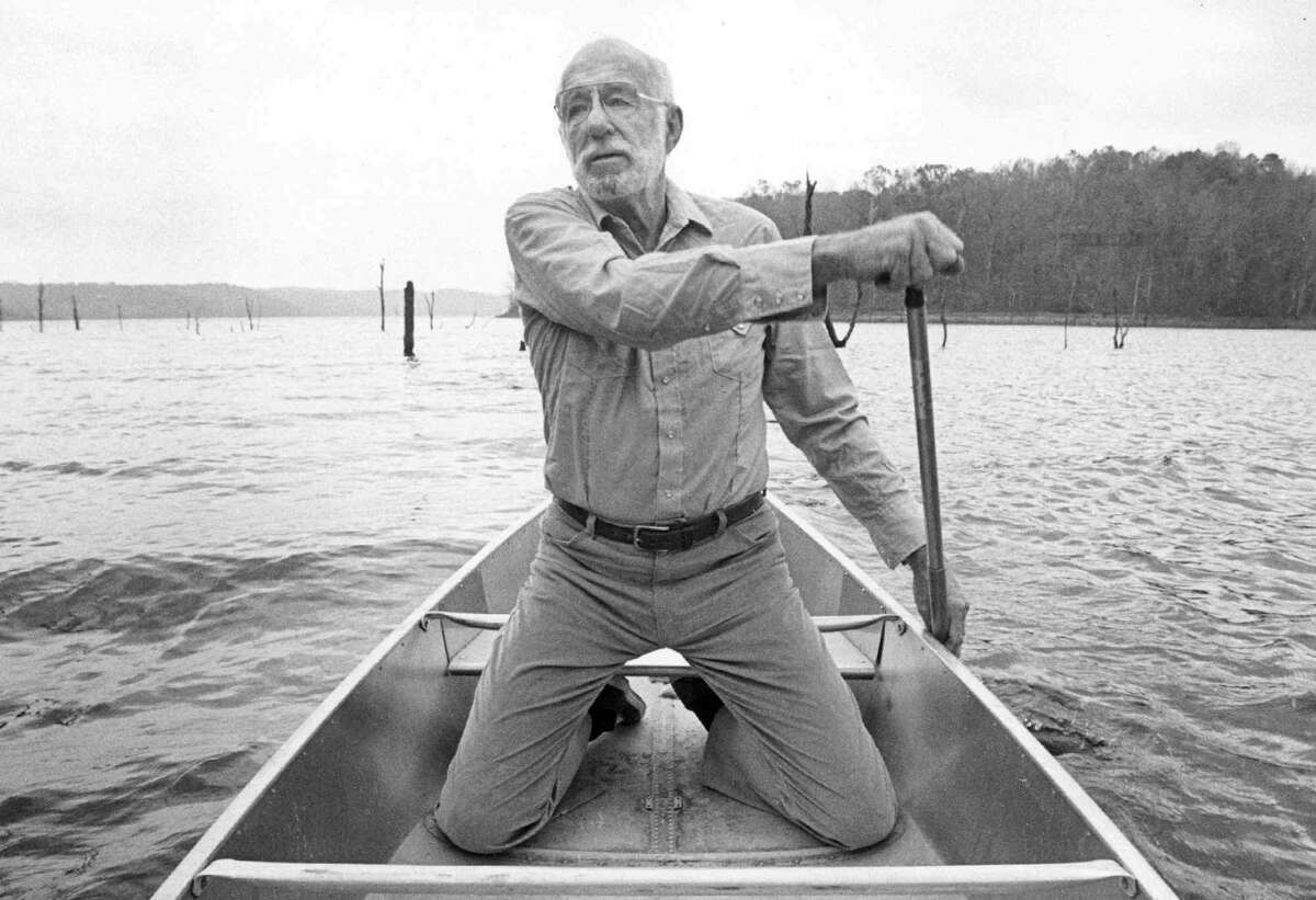 FILE-Dr. Benjamin Spock, shown in this1985 file photo rowing a canoe on Beaver lake near his Rogers, Ark., home, died Sunday, March 15, 1998, in San Diego. He was 94. The pediatrician, who as a student was a member of the 1924 Yale University rowing team, helped win the team a gold medal at the 1924 Olympics.