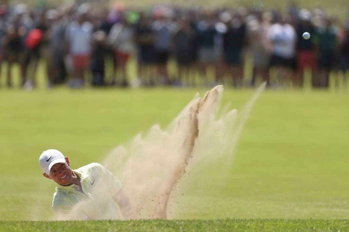 Northern Ireland's Rory McIlroy plays out of a bunker on the 7th green during the second round of the British Open Golf Championship at Royal St George's golf course Sandwich, England, Friday, July 16, 2021.