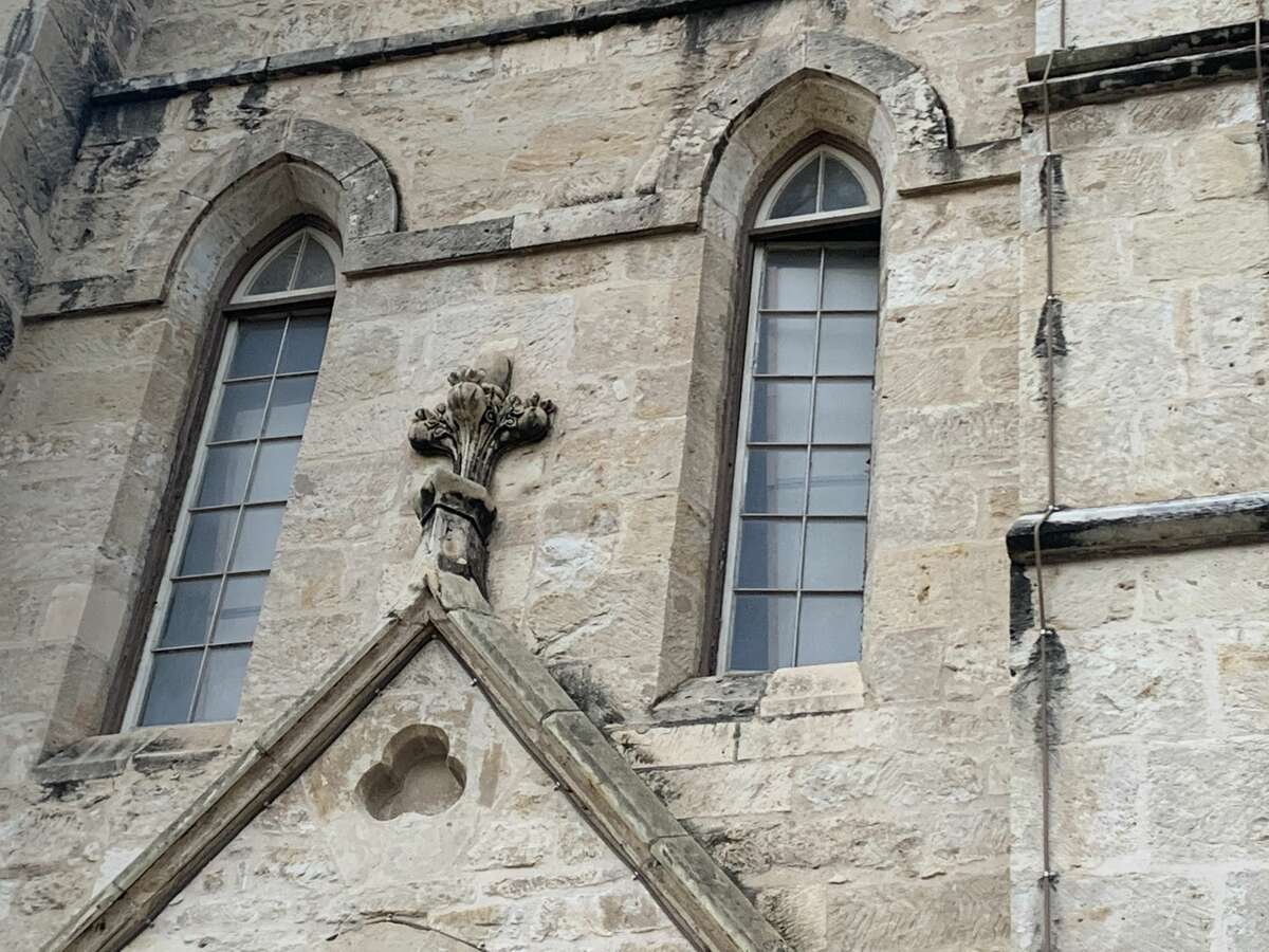 An ajar window at the locked and closed Cathedral. 