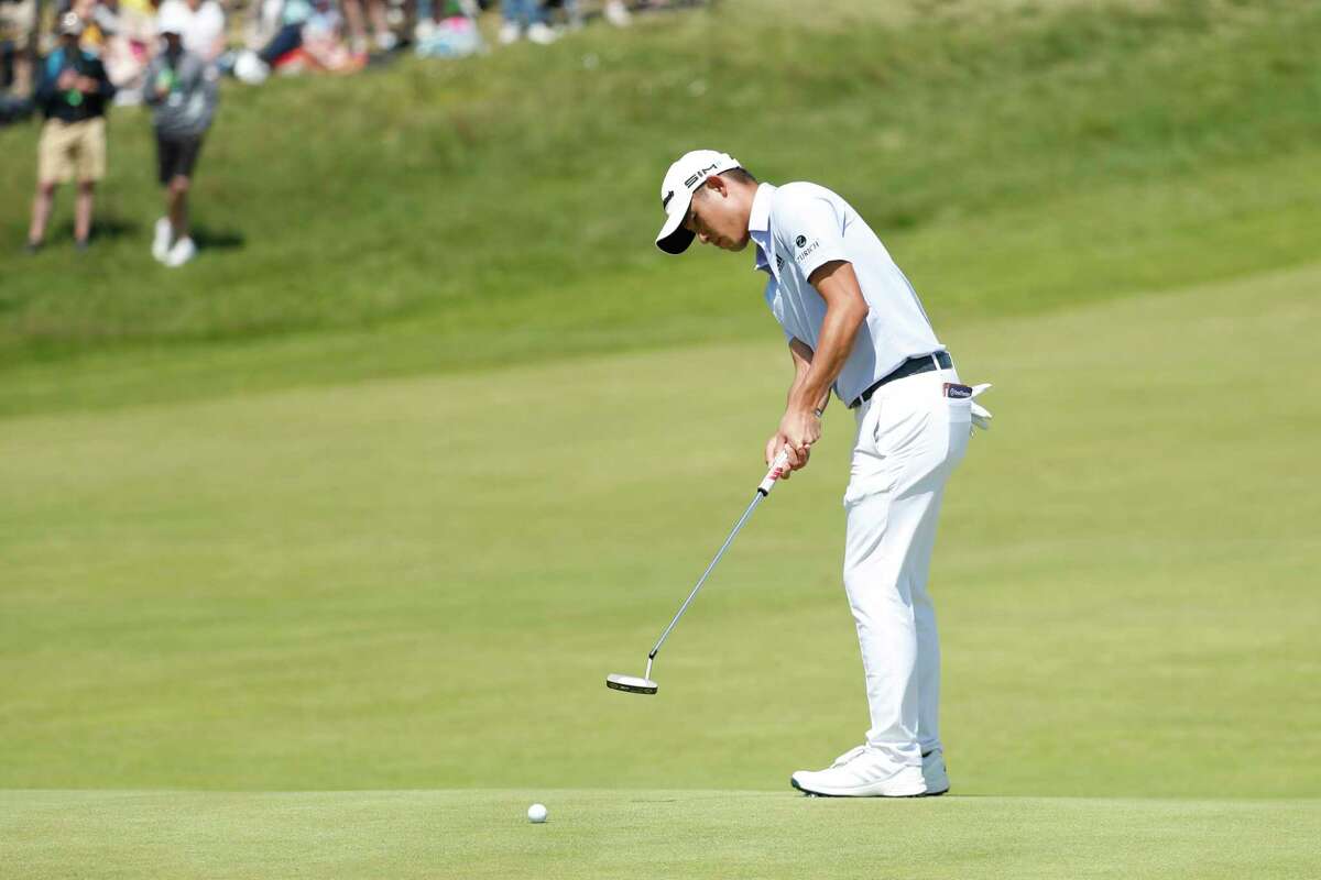 United States' Collin Morikawa putts on the 16th green during the second round of the British Open Golf Championship at Royal St George's golf course Sandwich, England, Friday, July 16, 2021.