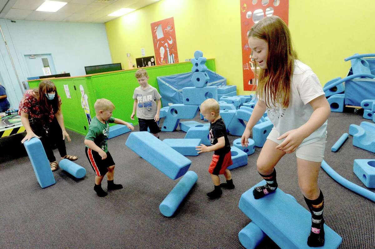 Izzy Caple balances on a foam teeter totter she created while playing with family at the Beaumont Children's Museum Thursday morning. Photo taken Thursday, September 24, 2020 Kim Brent/The Enterprise